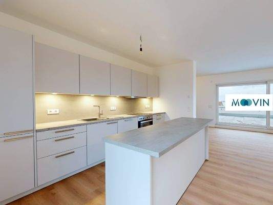 Blick von der offenen Küche in den Wohnbereich