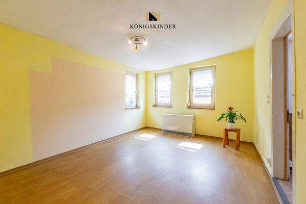 1.OG Wohnzimmer- Wärme und Gemütlichkeit: Das Herzstück des Hauses 