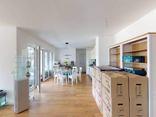 Ansicht II: Wohn- und Esszimmer mit offenem Küchenbereich