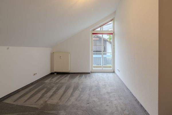 Schlafzimmer mit Balkonzugang