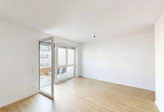 Ansicht I: Wohn- und Esszimmer mit offenem Küchenbereich