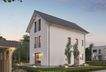 Dieses massa haus Fertighaus Einfamilienhaus im Lifestyle-Design präsentiert sich bei Abenddämmerung