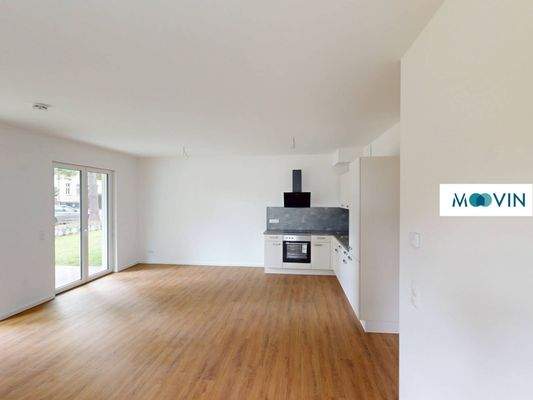 Ansicht III: Wohn- und Esszimmer mit offenem Küchenbereich