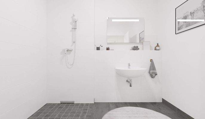 Ein modern gefliestes Badezimmer mit bodengleicher Dusche