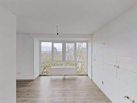 Ansicht VI: Wohn- und Esszimmer mit offenem Küchenbereich