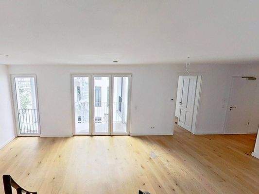 Ansicht IV: Wohn- und Esszimmer mit offenem Küchenbereich