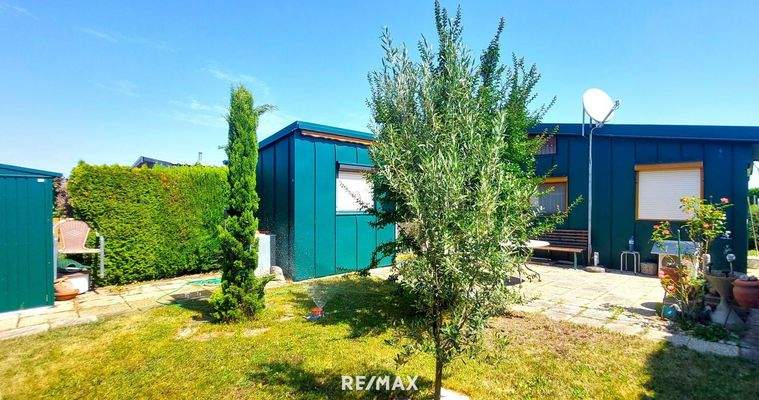 Blick vom Garten auf Mobilheim