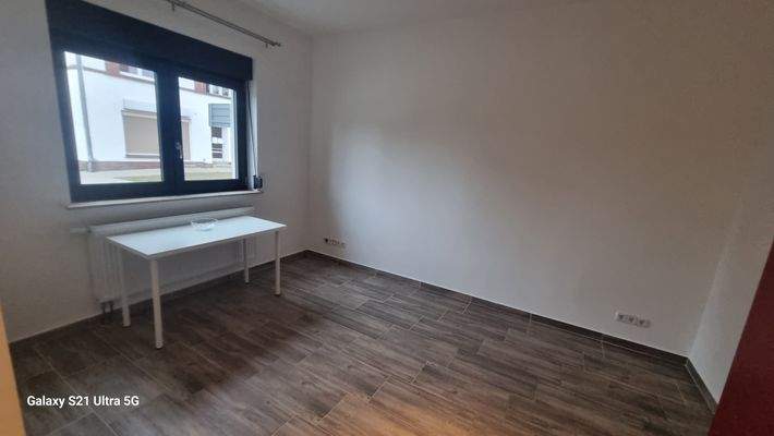 Zimmer mit offener Küche