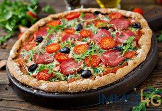 pizza-with-salami-tomatoes-olives-and-cheese-on-a-dough-with-whole-wheat-flour-italian-food