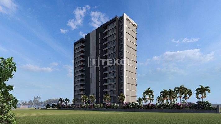 New Apartments in Mersin with a Pool and Modern Landscaping