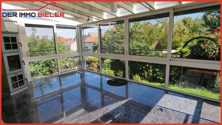 Wintergarten mit Kaminofen