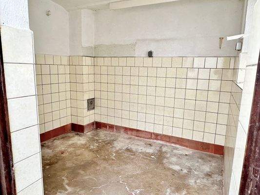 Nebenraum im Stalltrakt, ehemals Waschküche