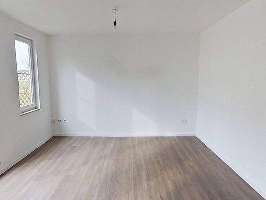 Ansicht II: Wohn- und Schlafzimmer mit offenem Küchenbereich