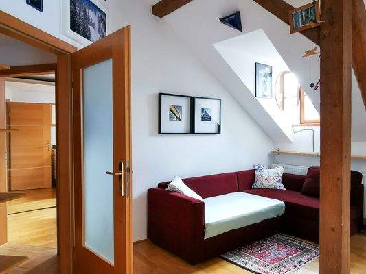 Bright,roomy living room with pull out couch.