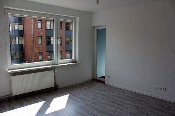 Wohnzimmer mit Balkonausgang