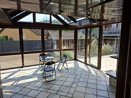 Wintergarten mit Kamin