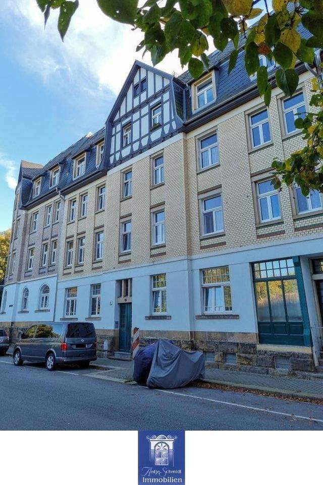 Sehenswerte Dachgeschosswohnung mit Balkon! - Foto 1