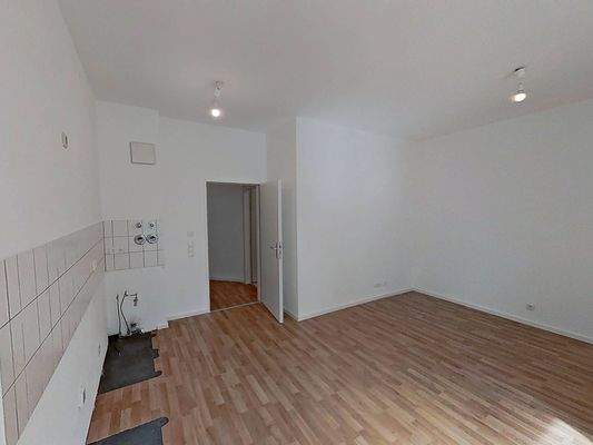 Ansicht III: Wohn- und Esszimmer mit offenem Küchenbereich