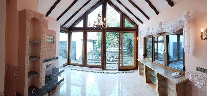 Wintergarten mit Kamin