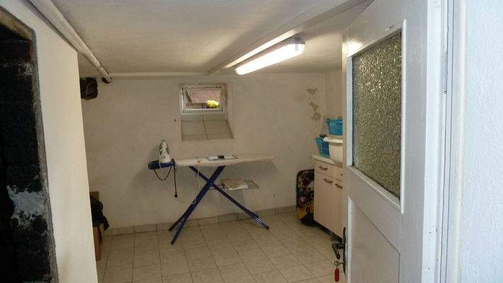 Bügelzimmer im Keller