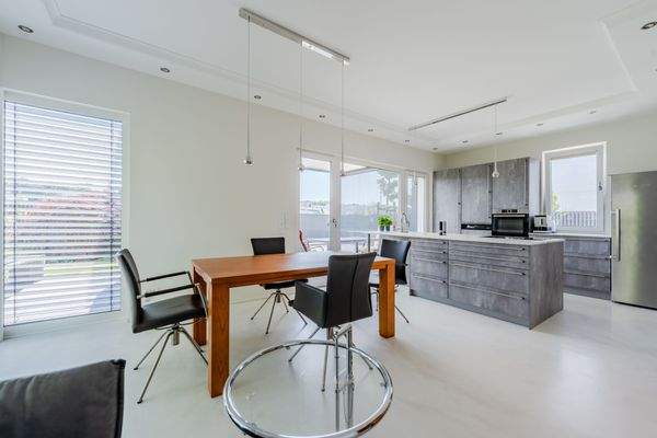 Open-plan dining and cooking area with a view of t