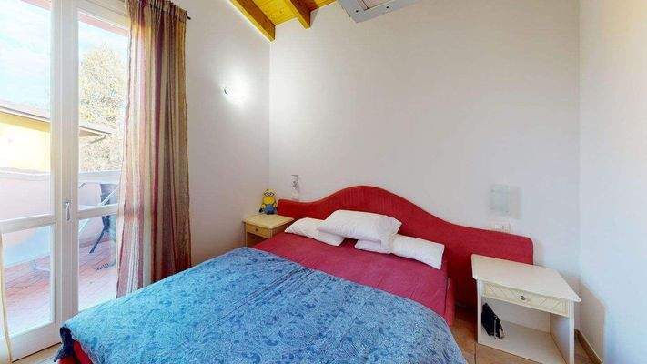 AM-056-Bilocale-in-residence-con-piscina-Bedroom 1