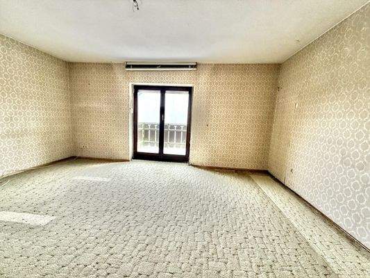 Schlafzimmer mit Balkonzugang