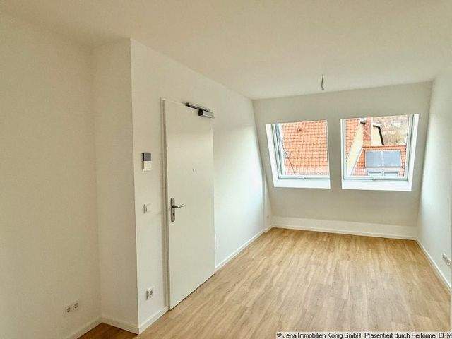 Erstbezug! Zentrumsnahes Einzimmerapartment mit Balkon, Einbauküche und Kamin - Photo 1