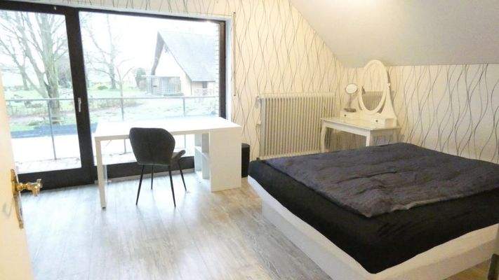 Schlafzimmer mit Balkon