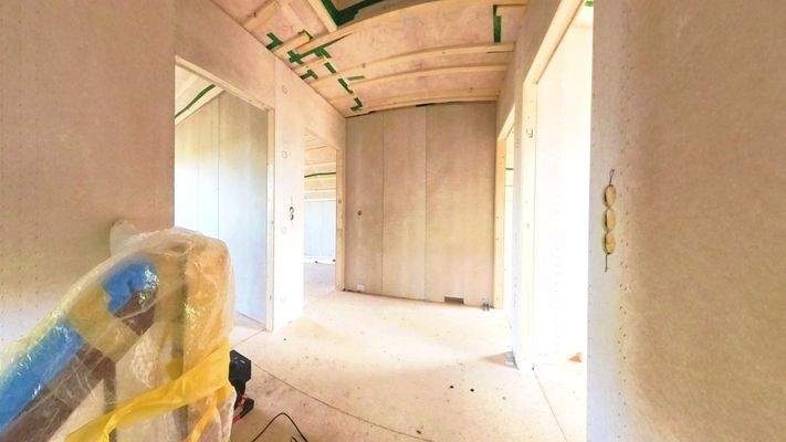 Empore als zentrale Diele im Dachgeschoss mit Zugang zu allen Räumen