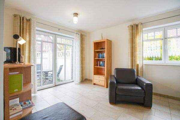 Wohnzimmer mit Zugang zur Terrasse