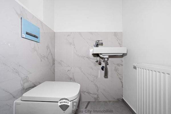 Toilette mit Handwaschbecken