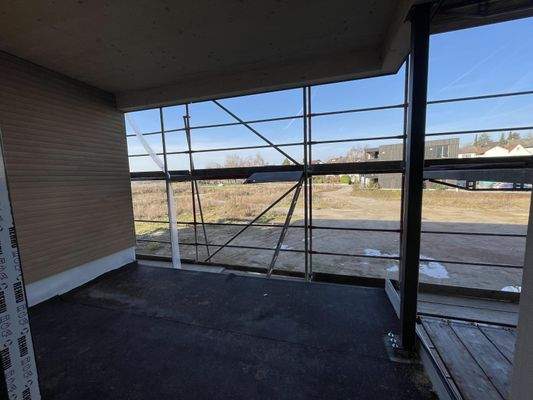 überdachter Westbalkon