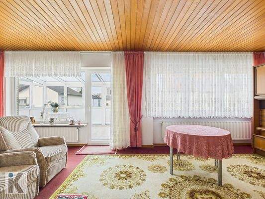 Wohnzimmer mit Wintergartenzugang