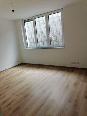 695a5cf3cbc709.02321545-Wohnzimmer UG (1).jpg