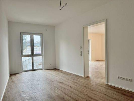 Schlafzimmer Blick Richtung Wohn- / Ess- / Küchenbereich