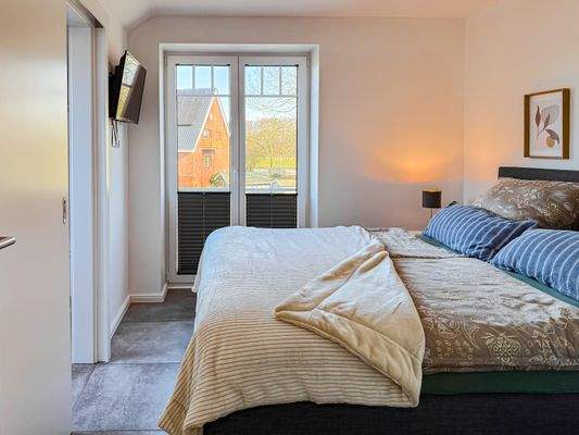 Schlafzimmer mit begehbaren Kleiderschrank