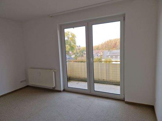 Wohnzimmer mit Balkon