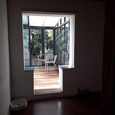 Blick v. Lesezimmer zum Wintergarten