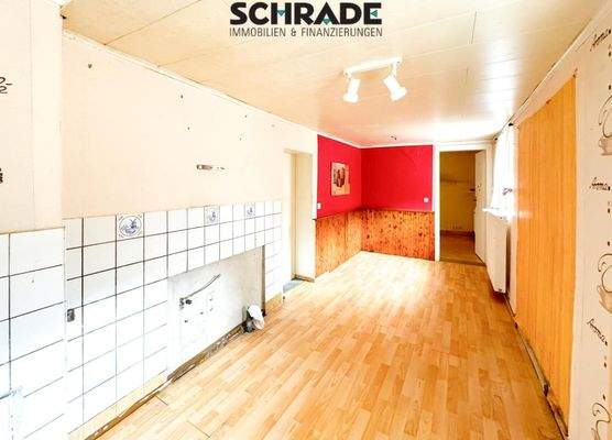 Die Küche mit hellem Sitzplatz