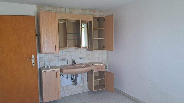 Schlafzimmer mit Waschbecken