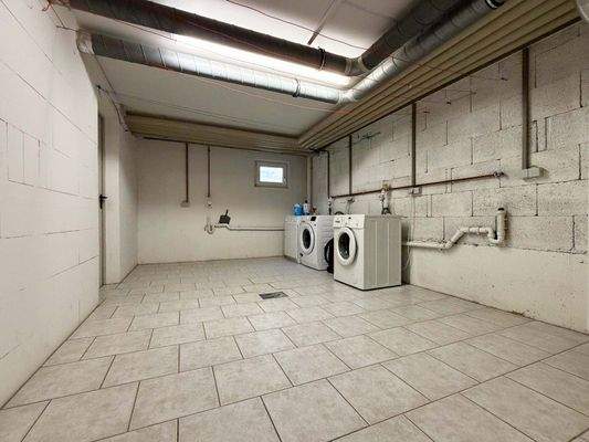 Waschraum: Separater Bereich für komfortable Organisation der Hauswäsche