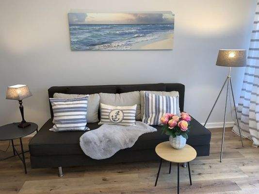 Wohnzimmer mit Schlafsofa