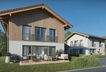 Moderne Architektur mit Holzfassade und sonniger Terrasse