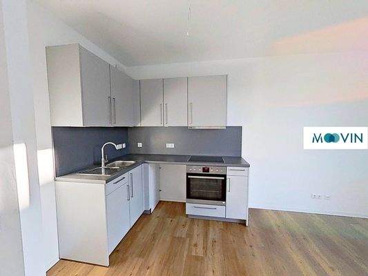 Ansicht III: Wohn- und Esszimmer mit offenem Küchenbereich