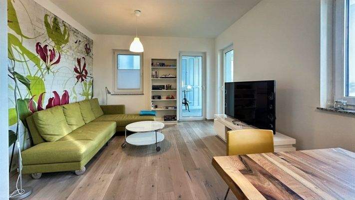 Wohnbereich mit Zugang zum Wintergarten