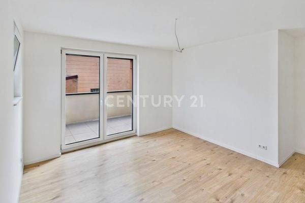 Schlafzimmer mit Zugang zum Balkon