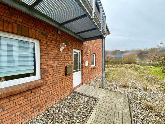 7) Außenansicht, Zugang Whg. EG