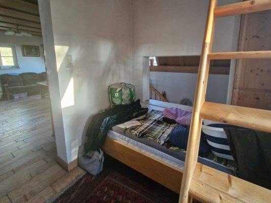 Schlafplatz mit Treppe zum DG