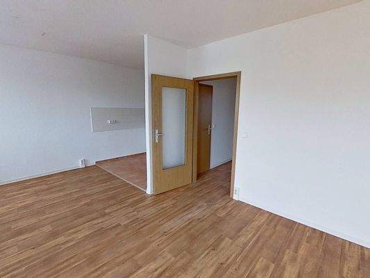 Ansicht V: Wohn- und Esszimmer mit offenem Küchenbereich